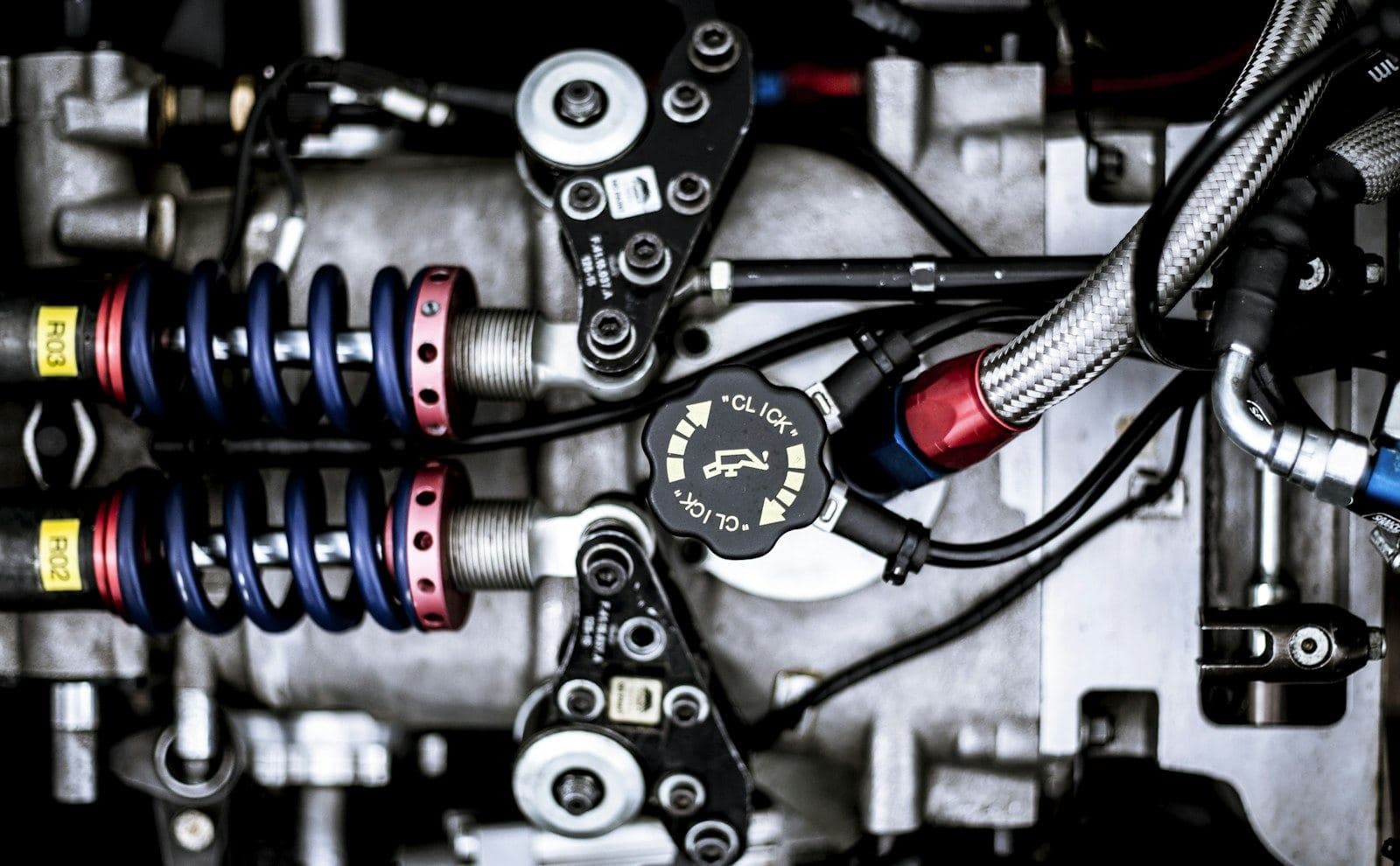 Close-up of machine parts, springs and hoses